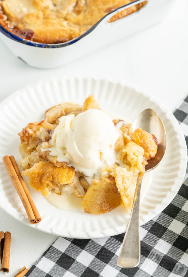 apple cobbler on plate with vanilla ice cream