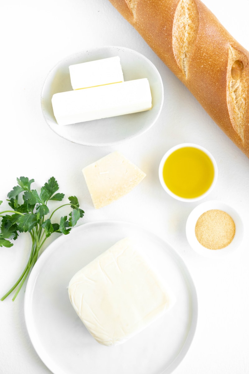 ingredients displayed for making cheesy garlic bread