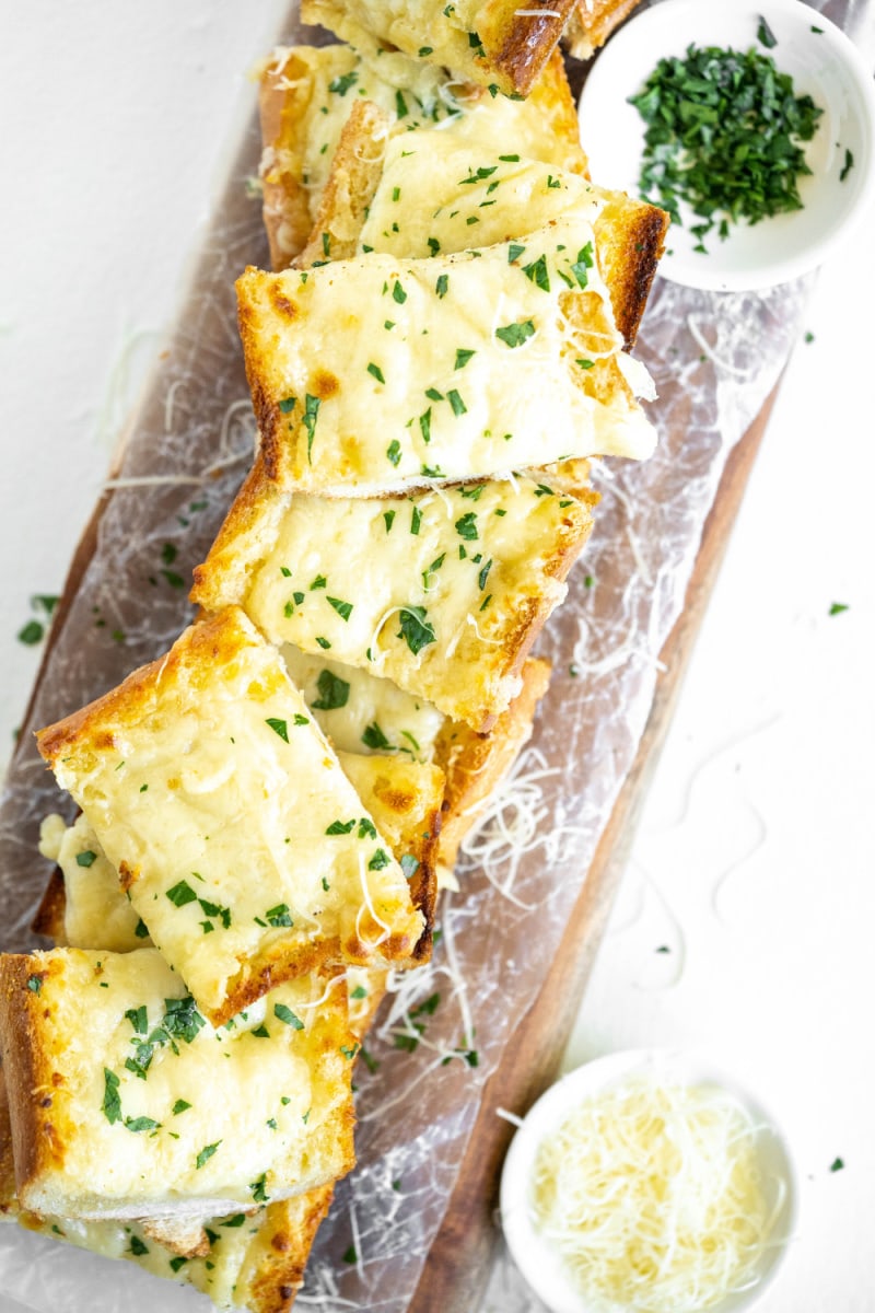 cheesy garlic bread displayed on platter