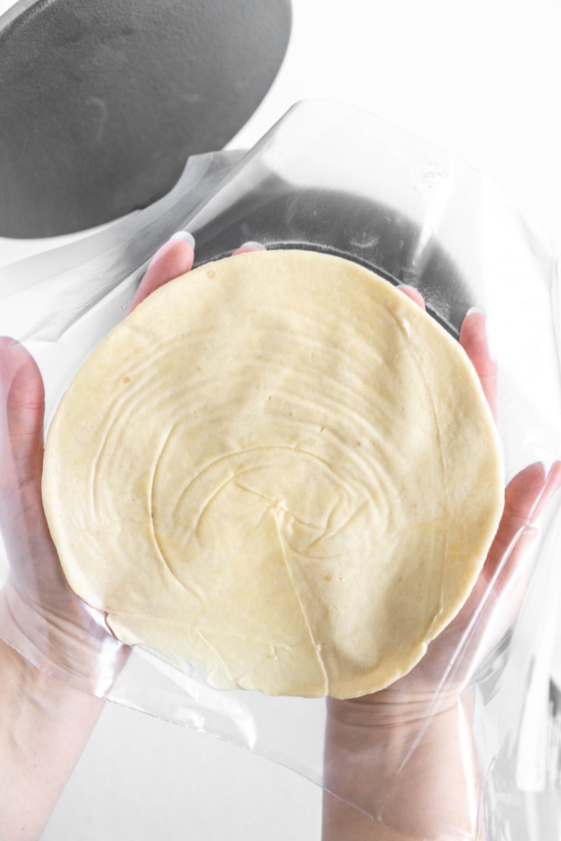 flattened dough ready for frying to make homemade flour tortilla