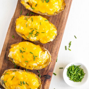 twice baked potatoes on a serving platter