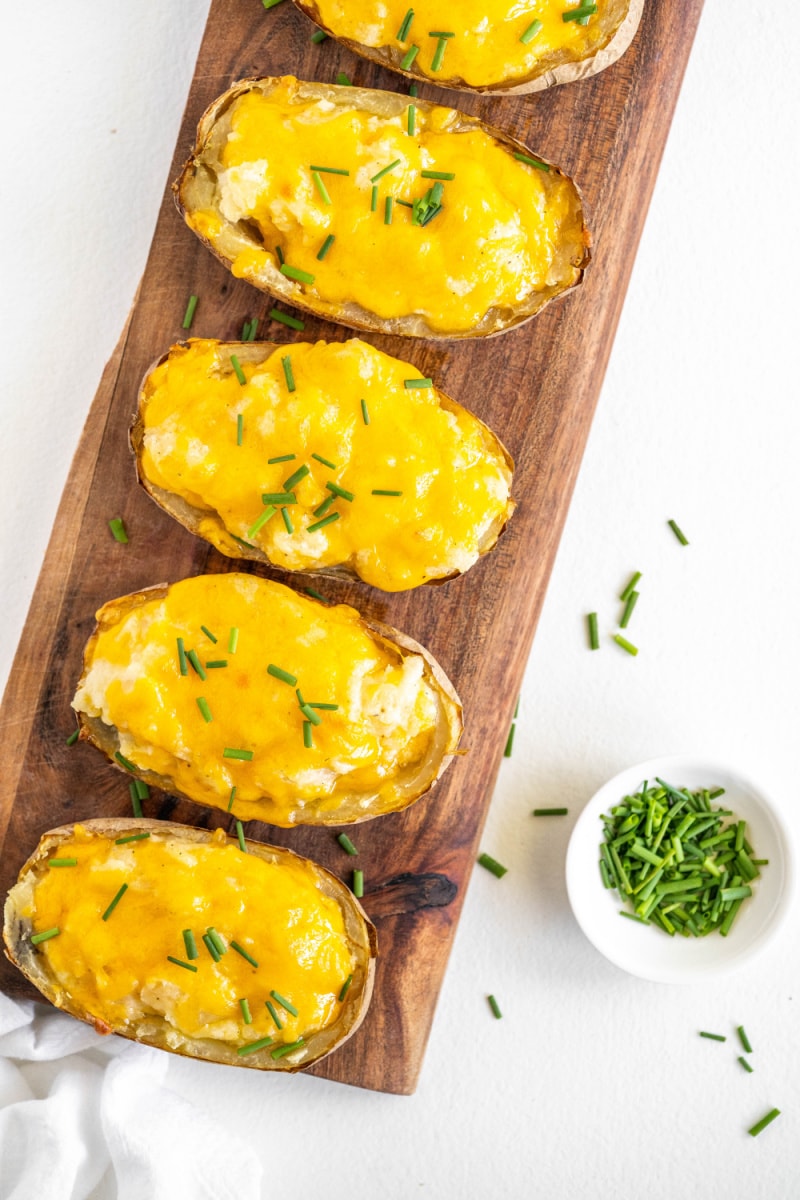 twice baked potatoes on a serving platter