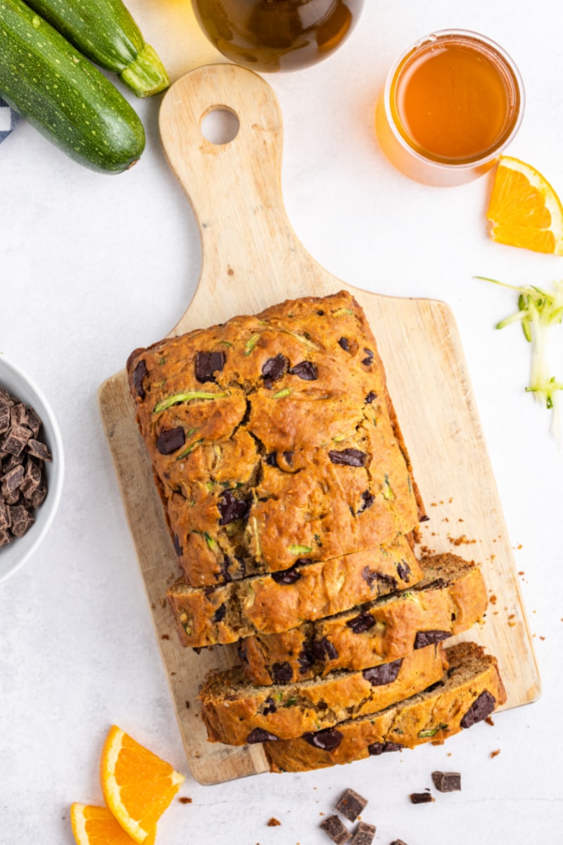 loaf of chocolate chunk zucchini bread on bread board