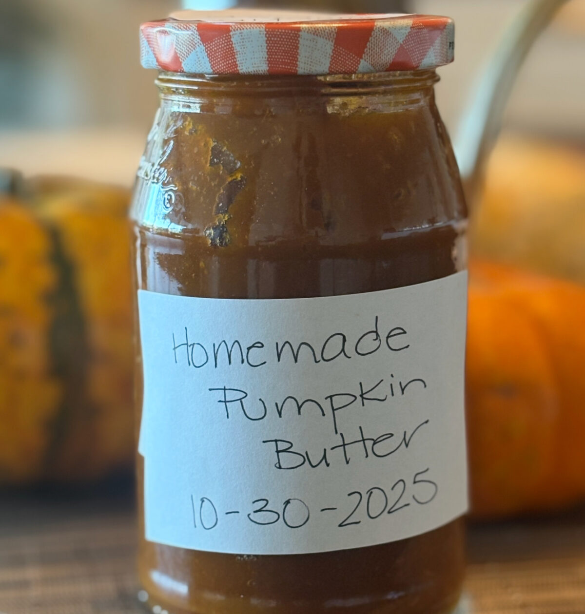 This easy homemade pumpkin butter tastes just like pumpkin pie in a jar! It’s smooth, spiced, and sweet — perfect for spreading on toast, pancakes, or biscuits. jar of homemade pumpkin butter