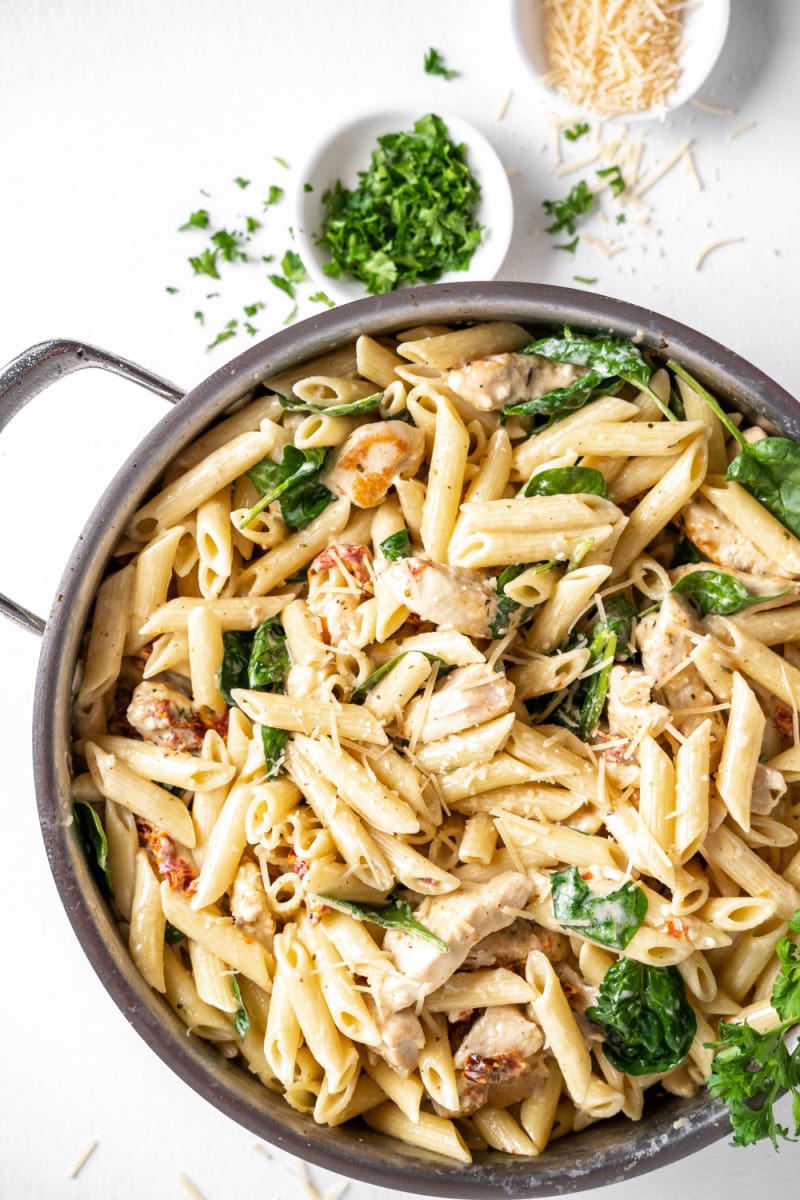 tuscan chicken pasta in a skillet