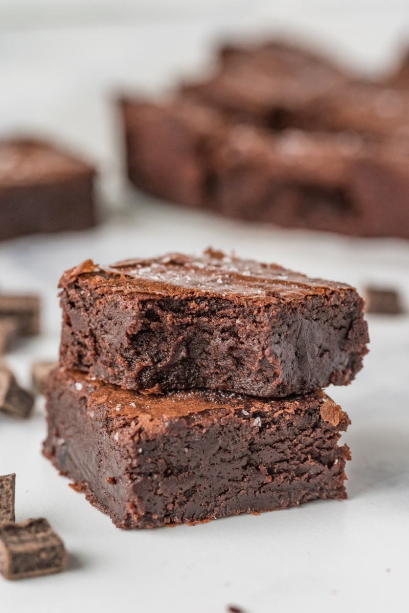 two brownies stacked, one with bite out of it