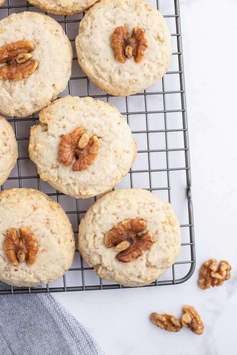 walnut meltaway cookies on cooling rack waiting for powdered sugar