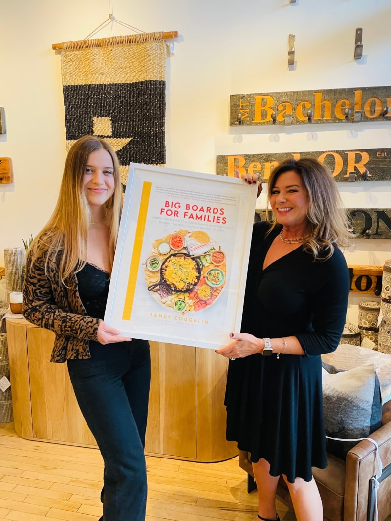 abby and sandy coughlin holding big boards for families book