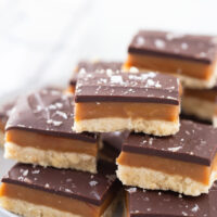 several pieces of millionaire shortbread stacked on a platter