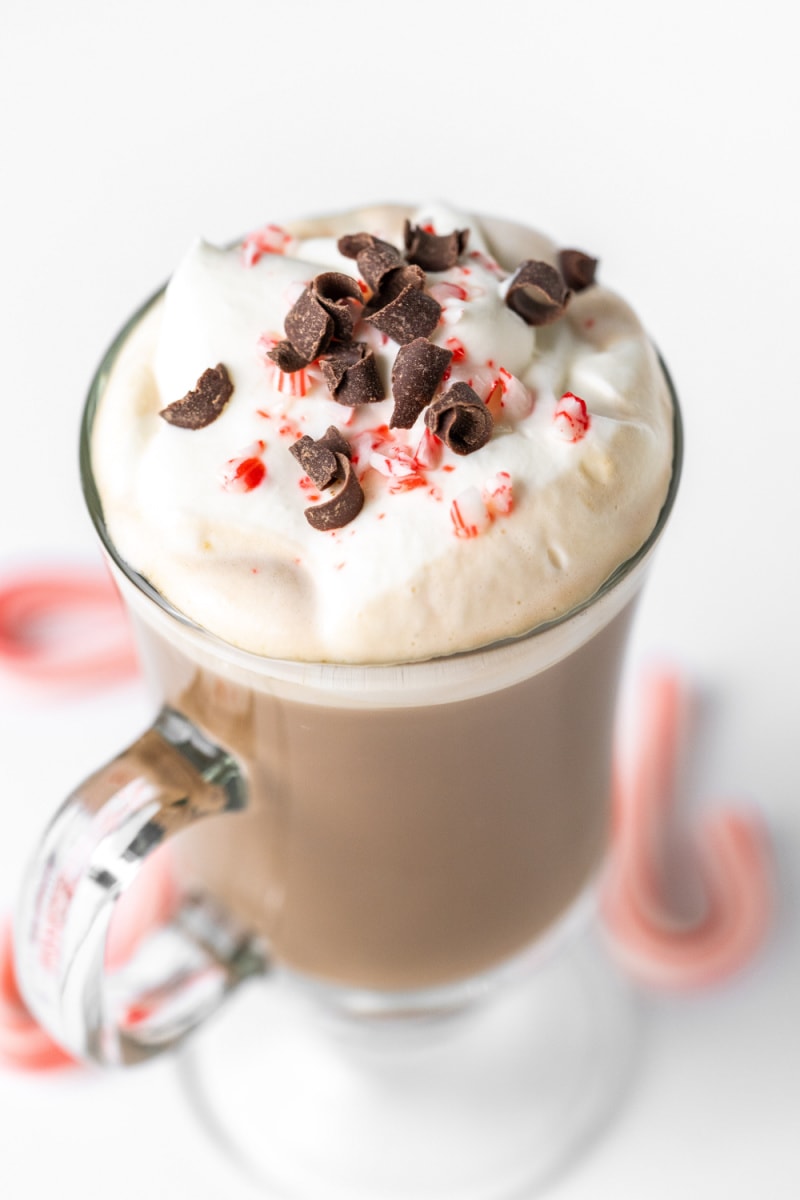 peppermint latte with whipped cream, candy cane and chocolate