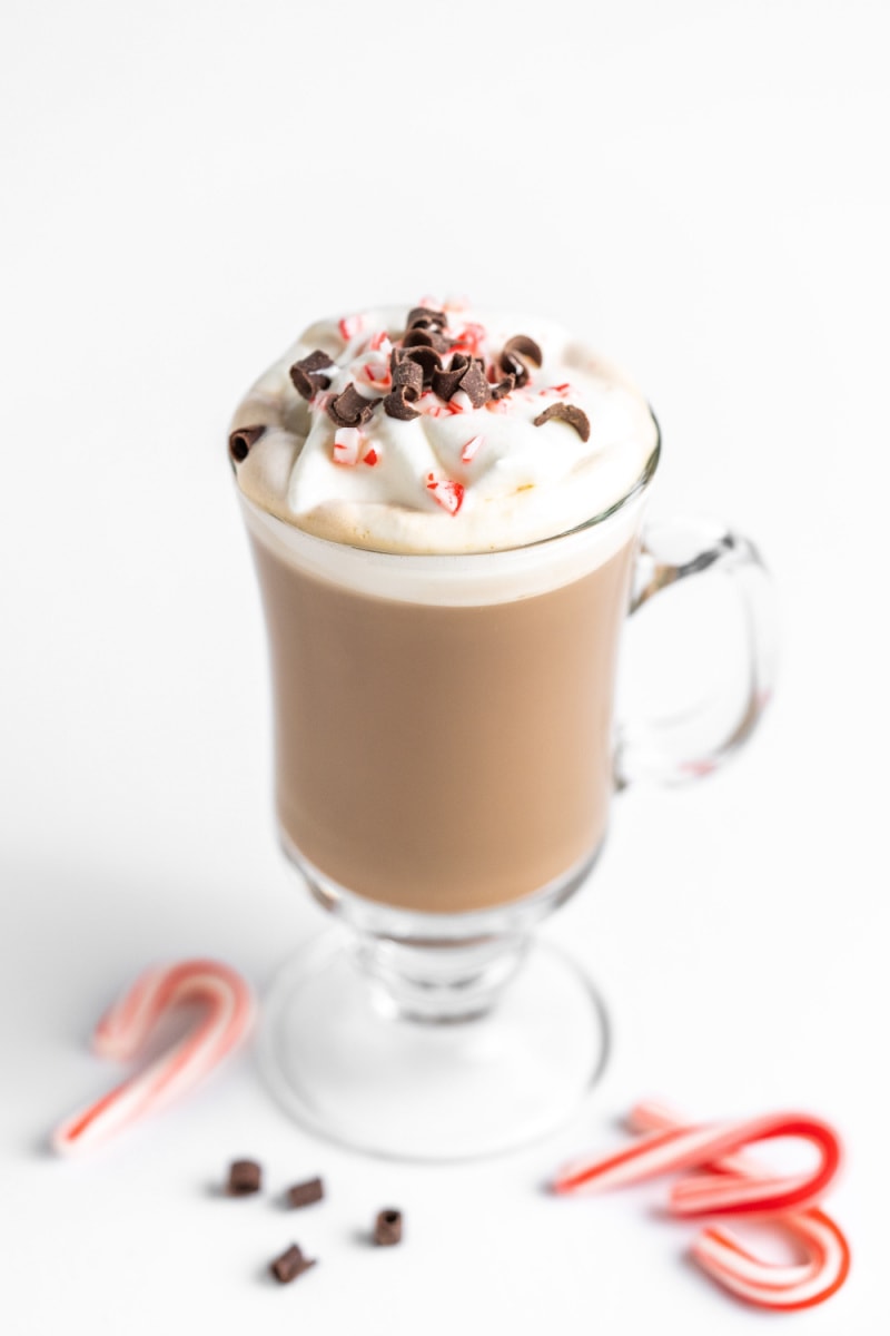 peppermint latte garnished with candy canes and chocolate