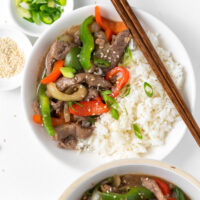 pepper steak served in bowl with rice