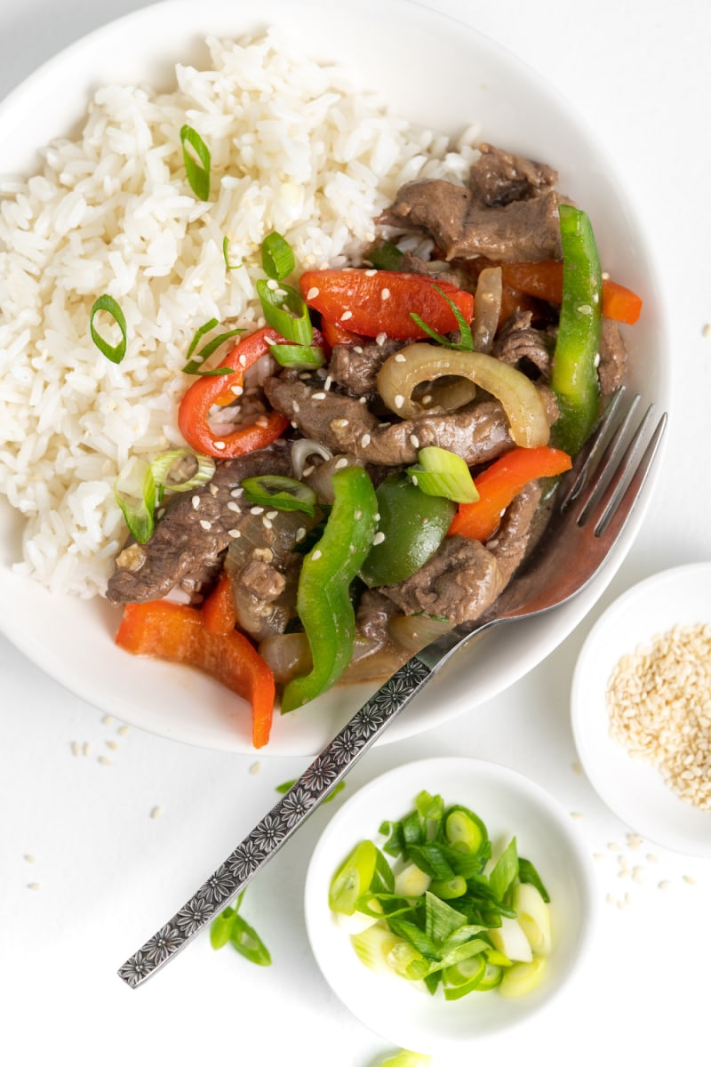 pepper steak served in bowl with rice