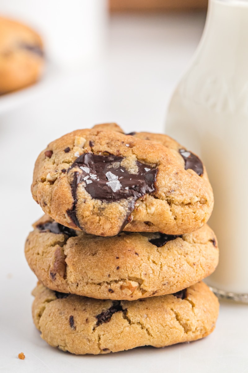 stack of three brown butter pecan chocolate chip cookies