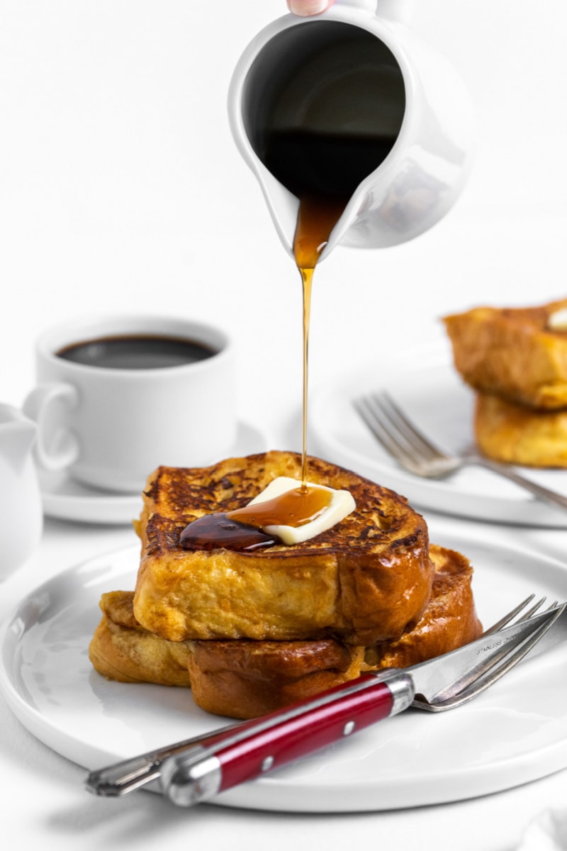 syrup pouring onto a stack of french toast