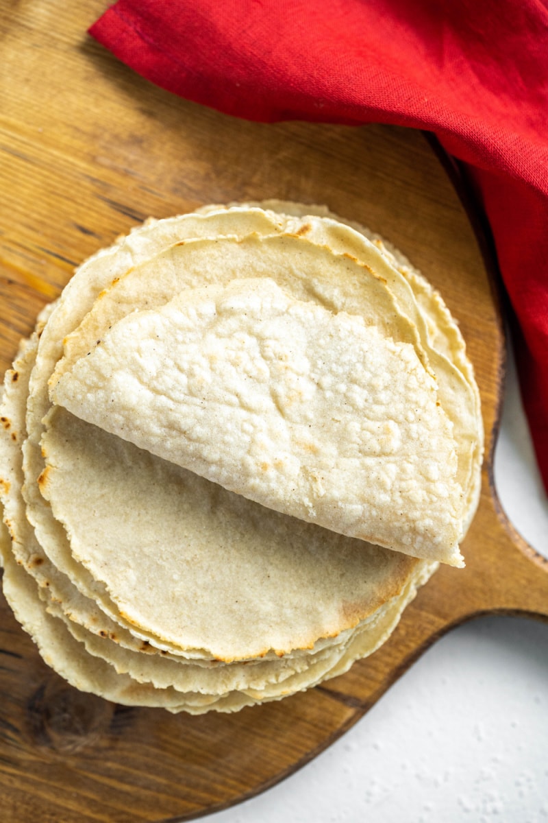 stack of corn tortillas with folded one on top