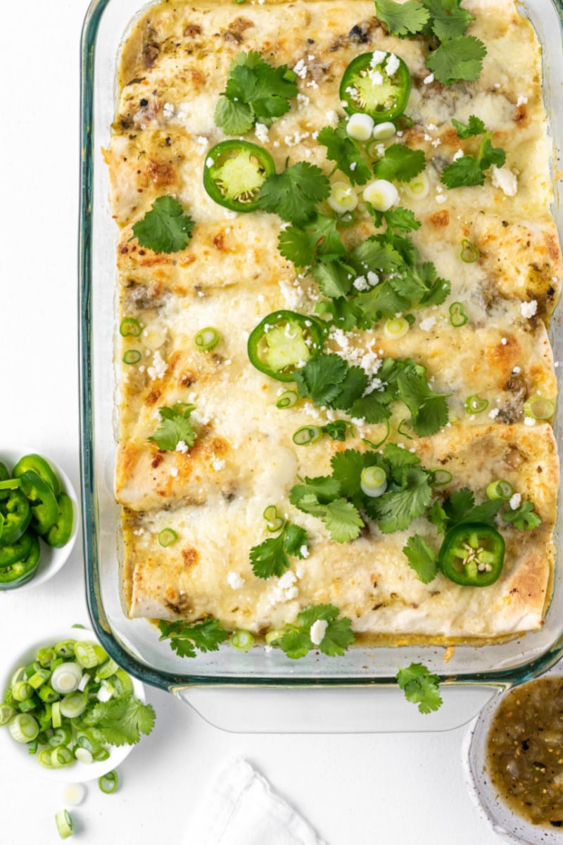 dish of salsa verde chicken enchiladas