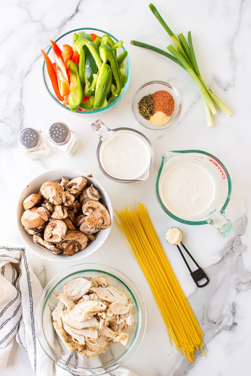 ingredients displayed for making cajun chicken pasta