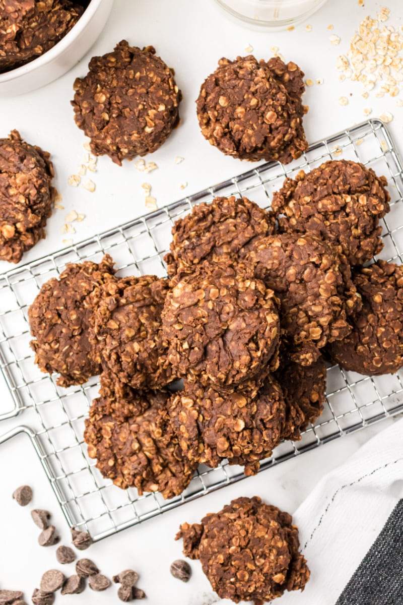 no bake chocolate peanut butter cookies stacked on cooling rack