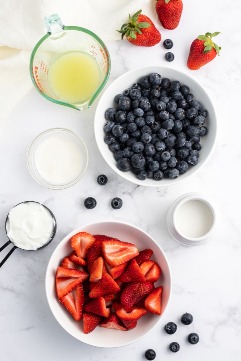 ingredients displayed for making red white and blueberry popsicles