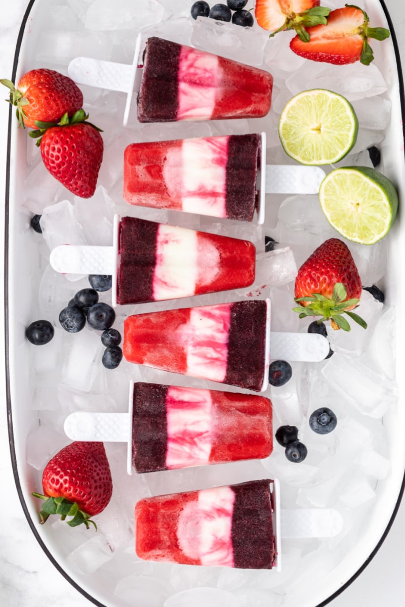 red white and blueberry popsicles on ice