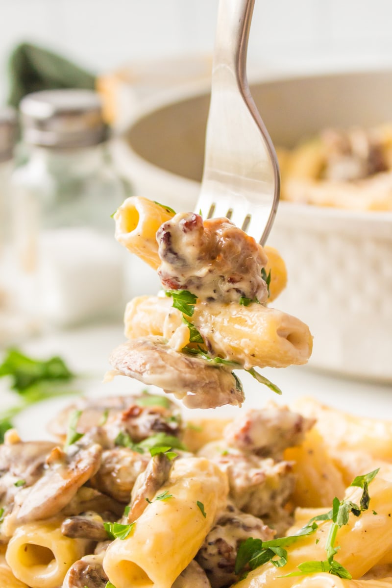 fork full of creamy sausage mushroom rigatoni