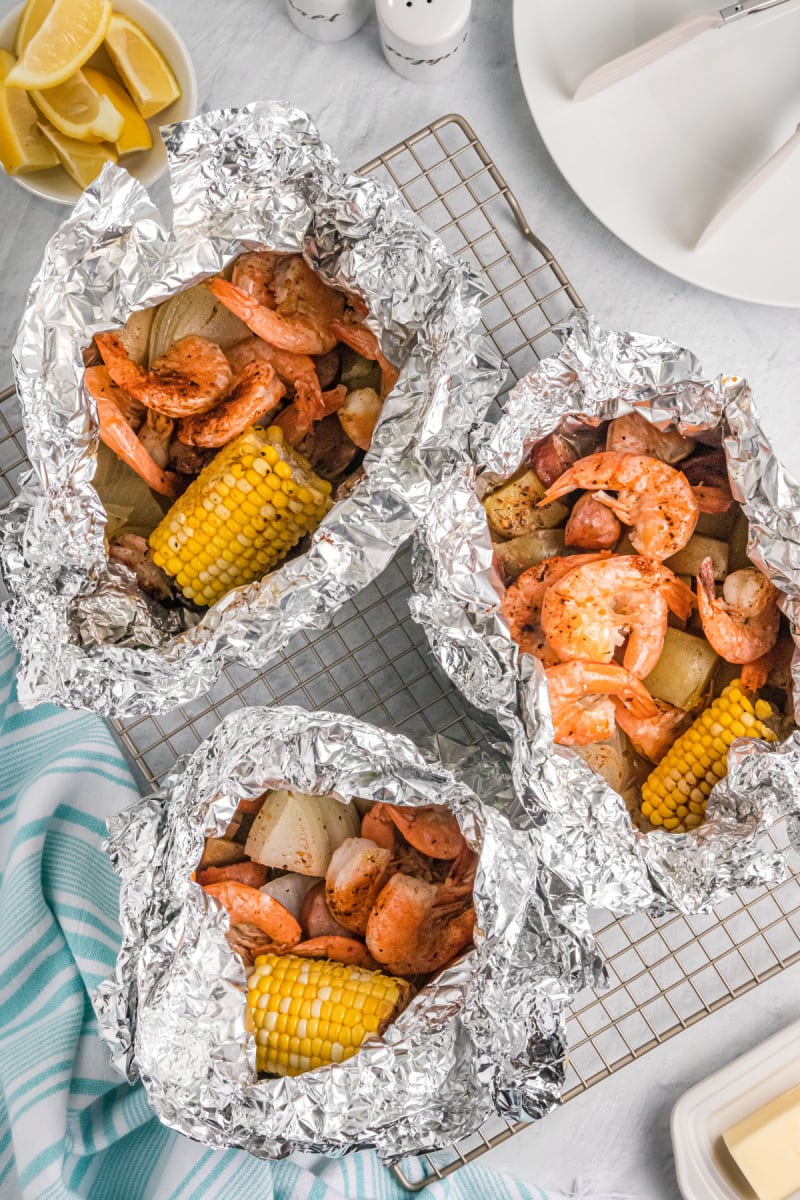 three grilled shrimp packets