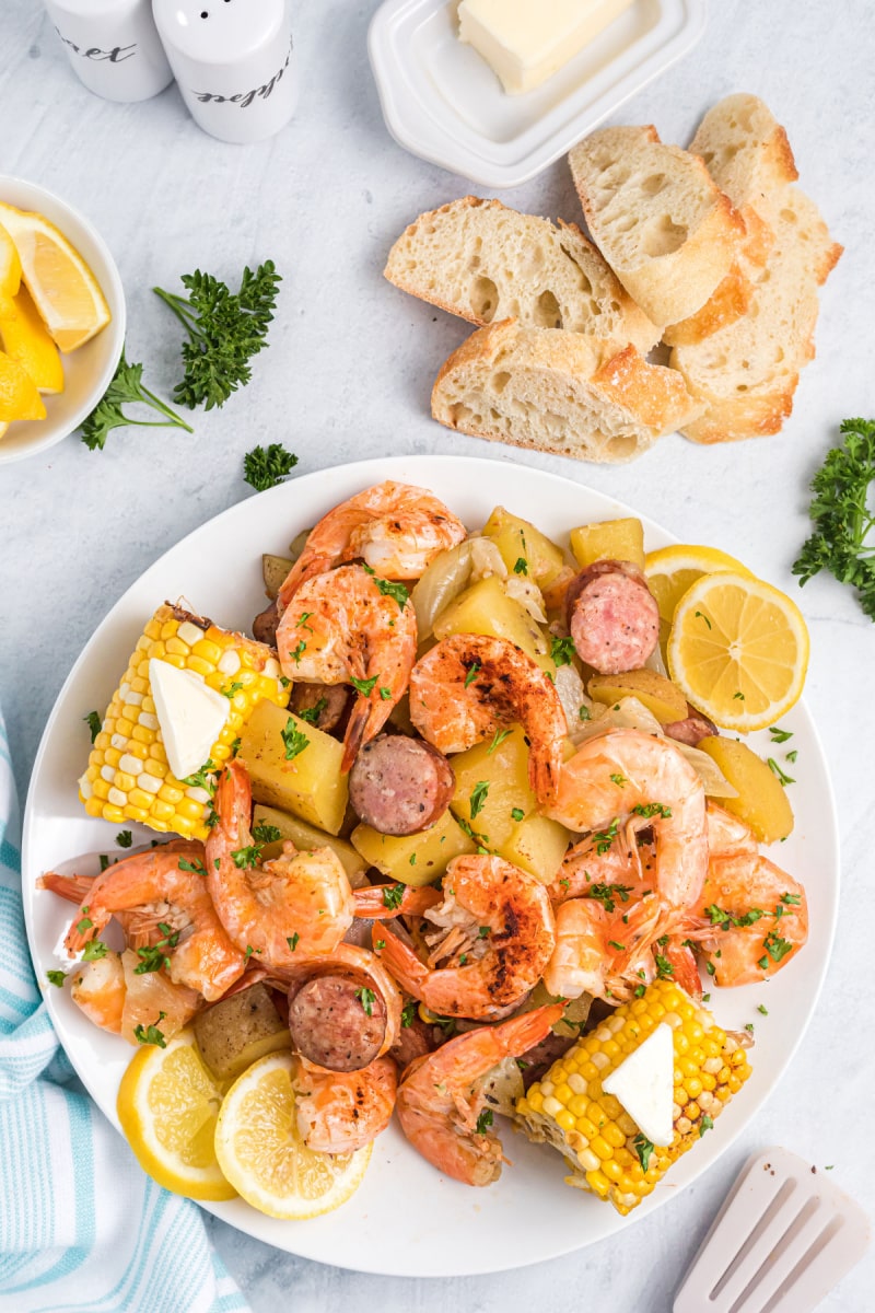 shrimp, sausage, corn and potatoes on plate