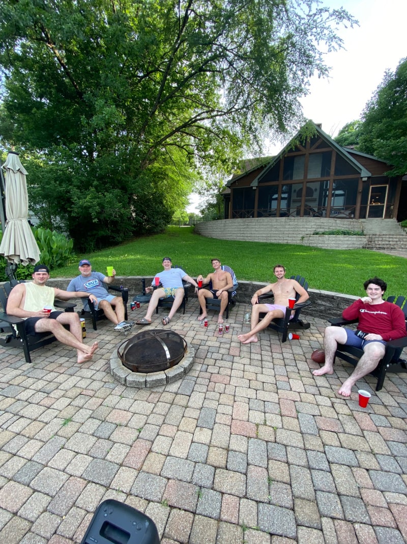 college kids at a fire pit in texas