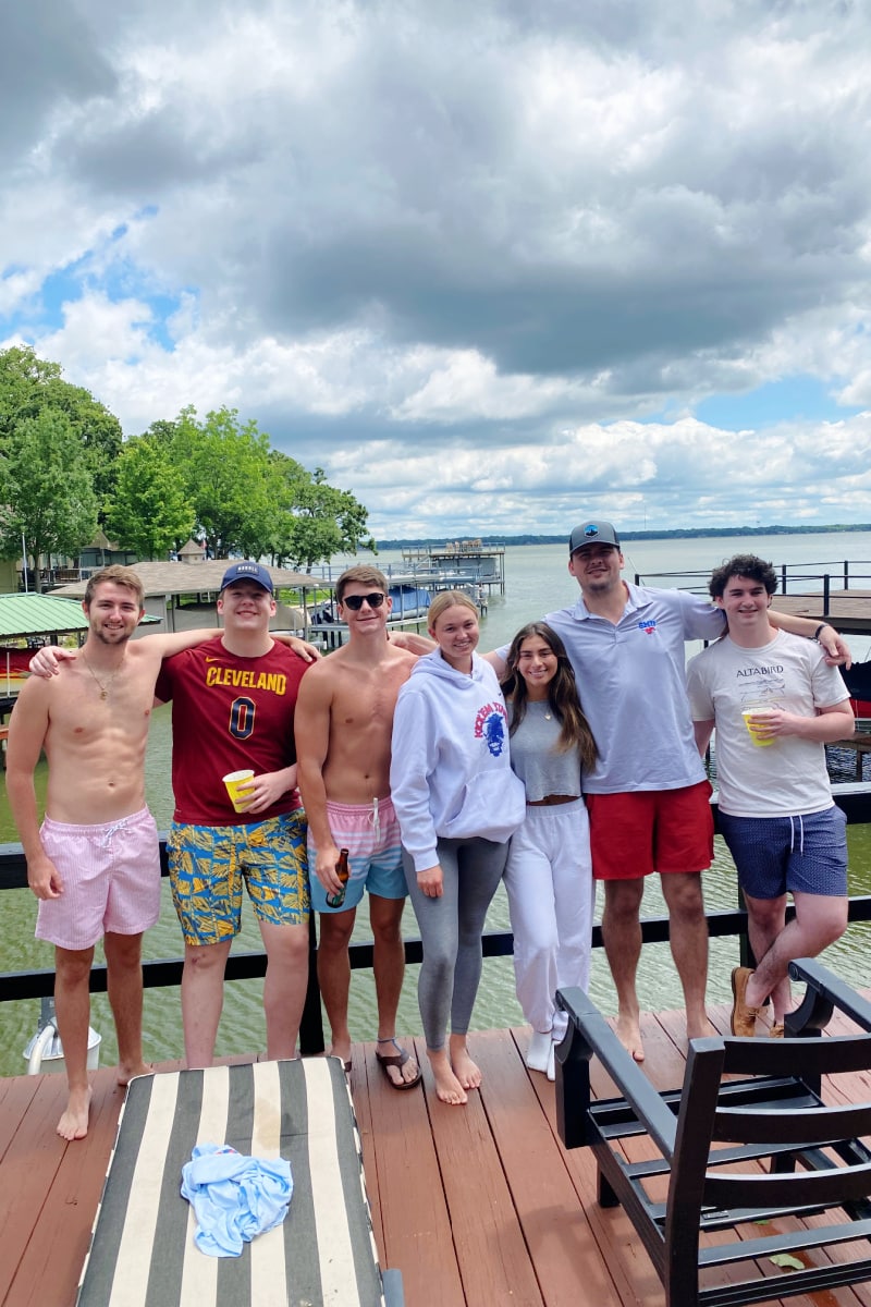 college kids on a boat dock