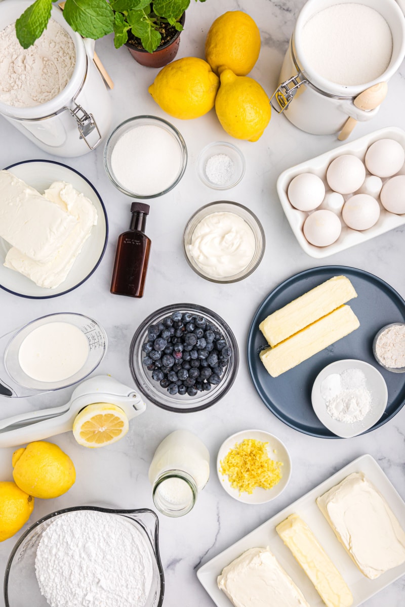 ingredients displayed for making blueberry cheesecake cake