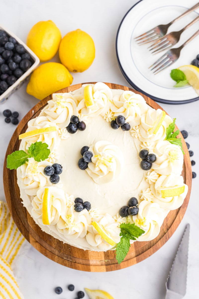 Blueberry Cheesecake Cake recipe from RecipeGirl.com #lemon #blueberry #cheesecake #cake #recipe #RecipeGirl overhead shot of blueberry cheesecake cake