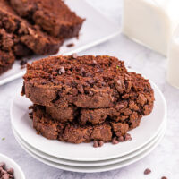 three slices of chocolate zucchini bread on a plate