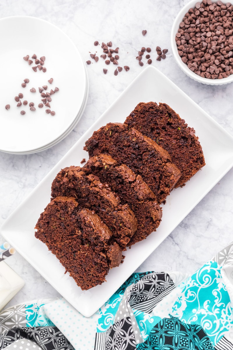 five slices of chocolate zucchini bread on a plate