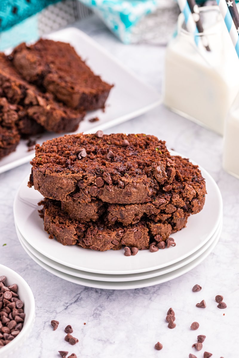 three slices of chocolate zucchini bread on a plate