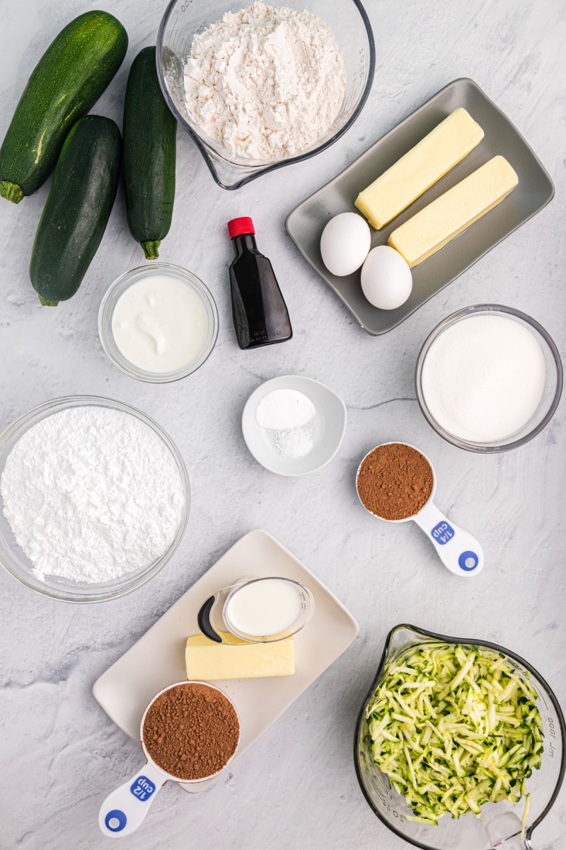 ingredients displayed for making chocolate zucchini brownie cake