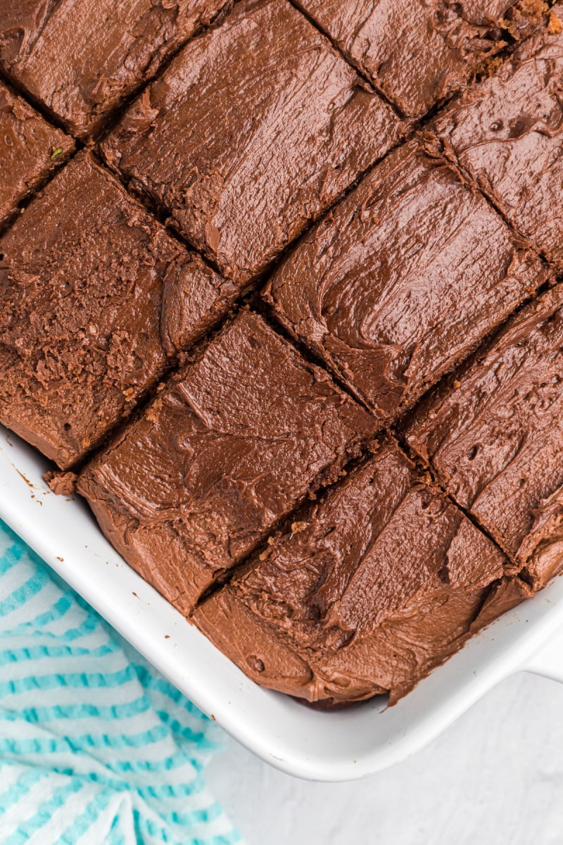 chocolate zucchini brownie cake in baking dish cut into slices