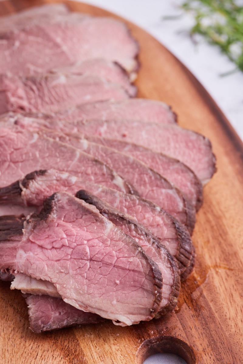 swedish roast beef cut into slices on board