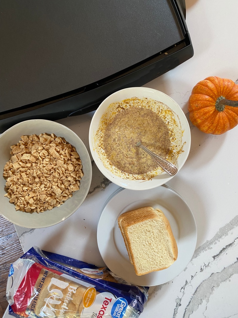 ingredients and griddle displayed for making pumpkin french toast