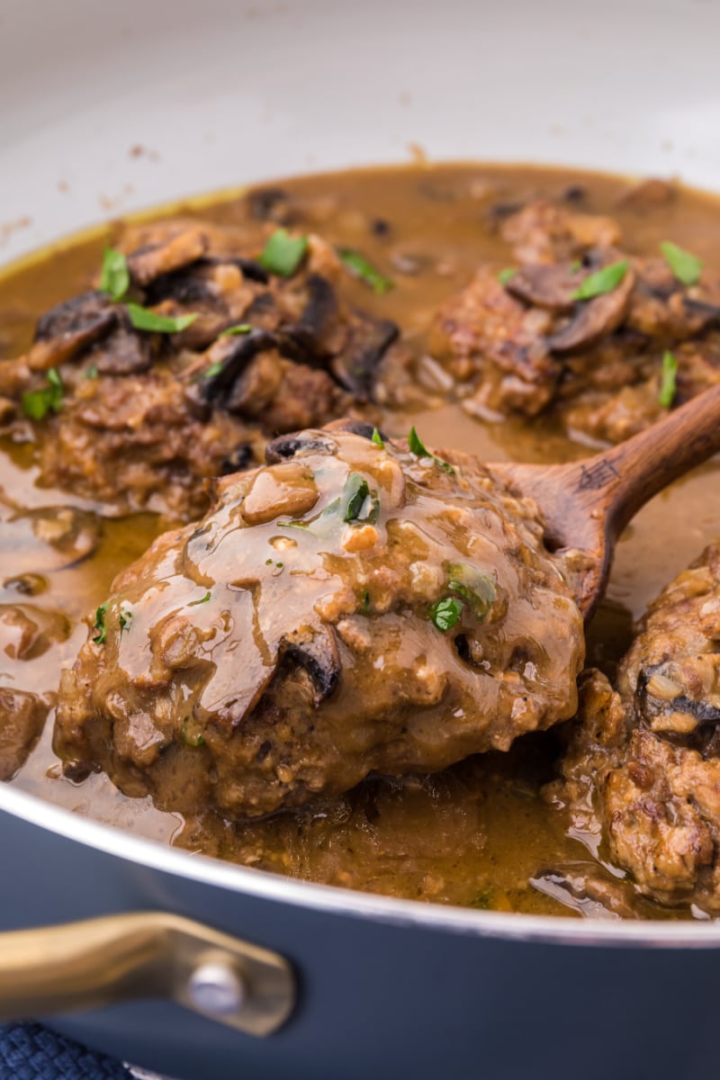 salisbury steak in pan with mushroom gravy