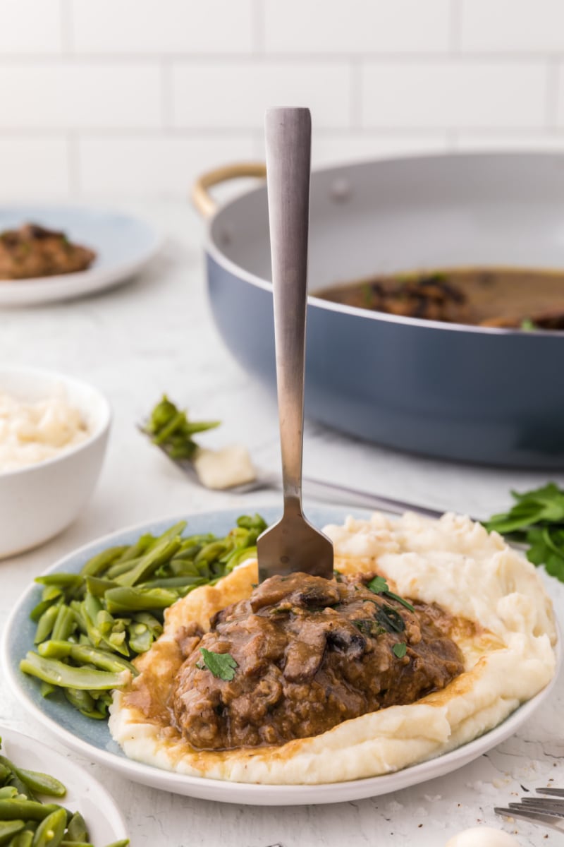 salisbury steak with mashed potatoes on a plate