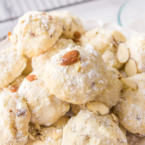 almond cream cheese snowball cookies displayed on a platter