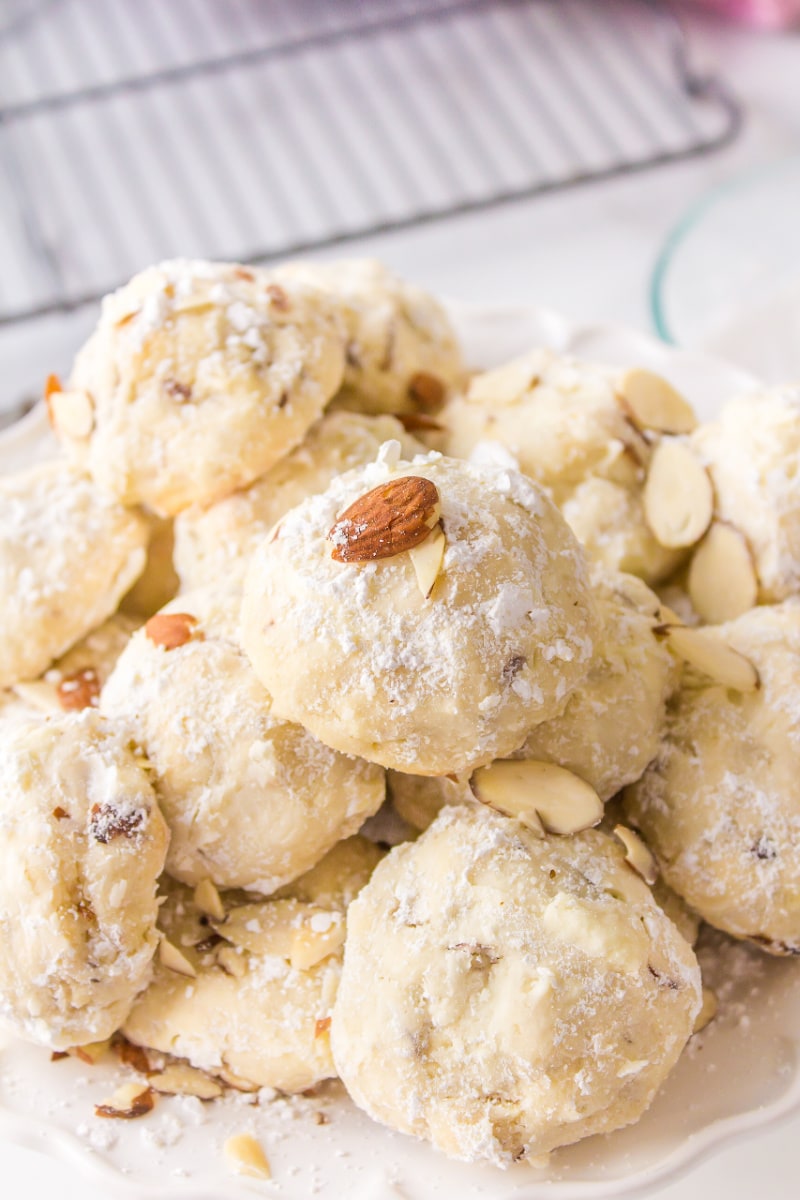 almond cream cheese snowball cookies displayed on a platter