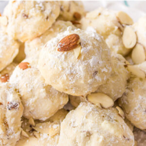 pinterest image for almond cream cheese snowball cookies