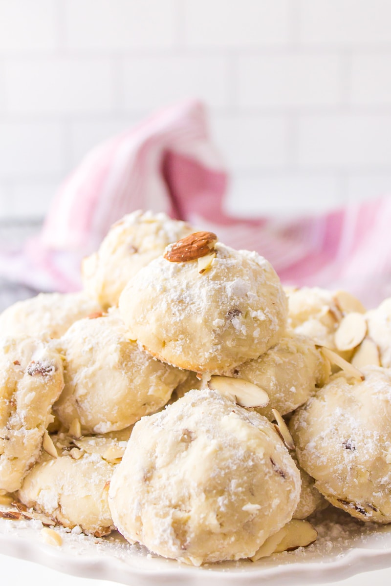 almond cream cheese snowball cookies displayed on a platter