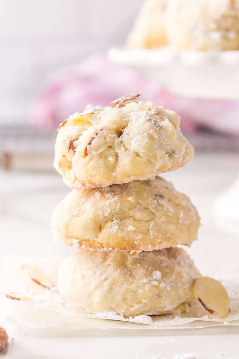 three almond cream cheese snowball cookies stacked