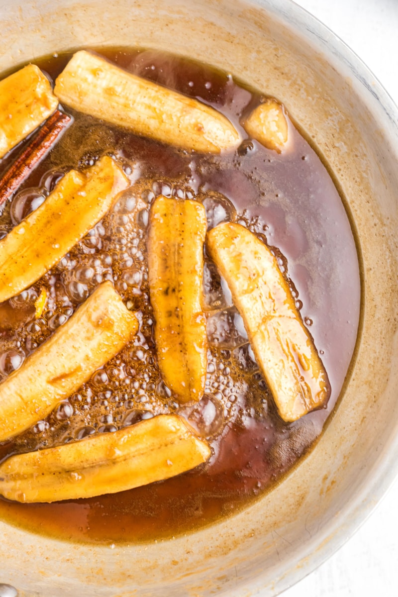 bananas foster cooking in a skillet