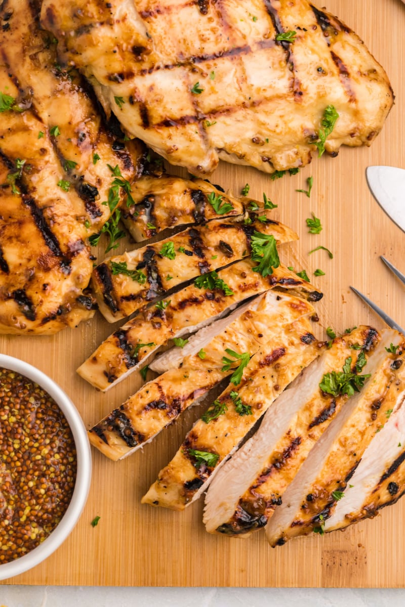 honey mustard grilled chicken sliced on cutting board