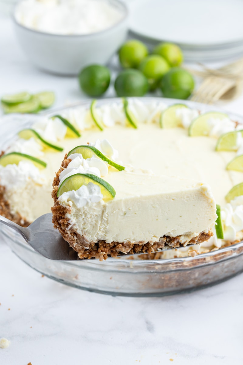 spatula taking out slice of margarita key lime pie
