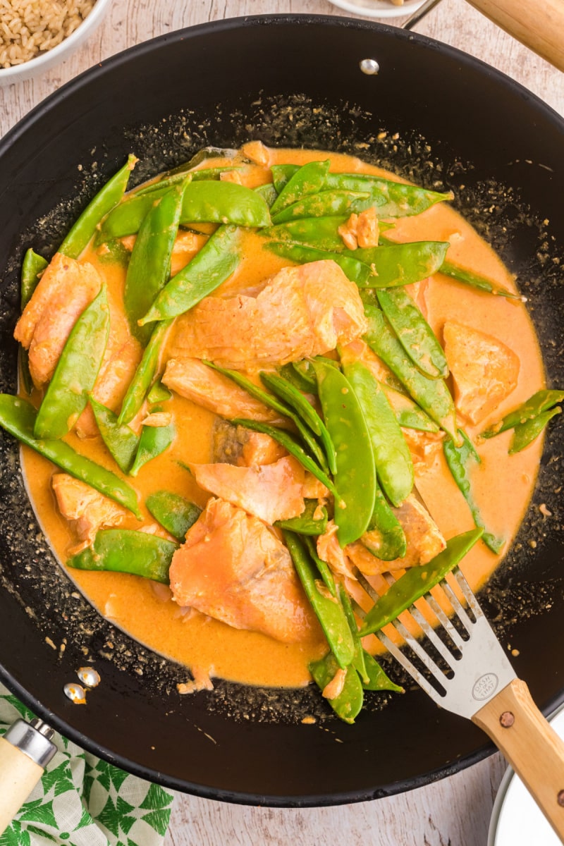 skillet of thai coconut red curry salmon